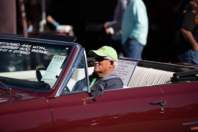 Mecum green hat driver olds 442 behind wheel