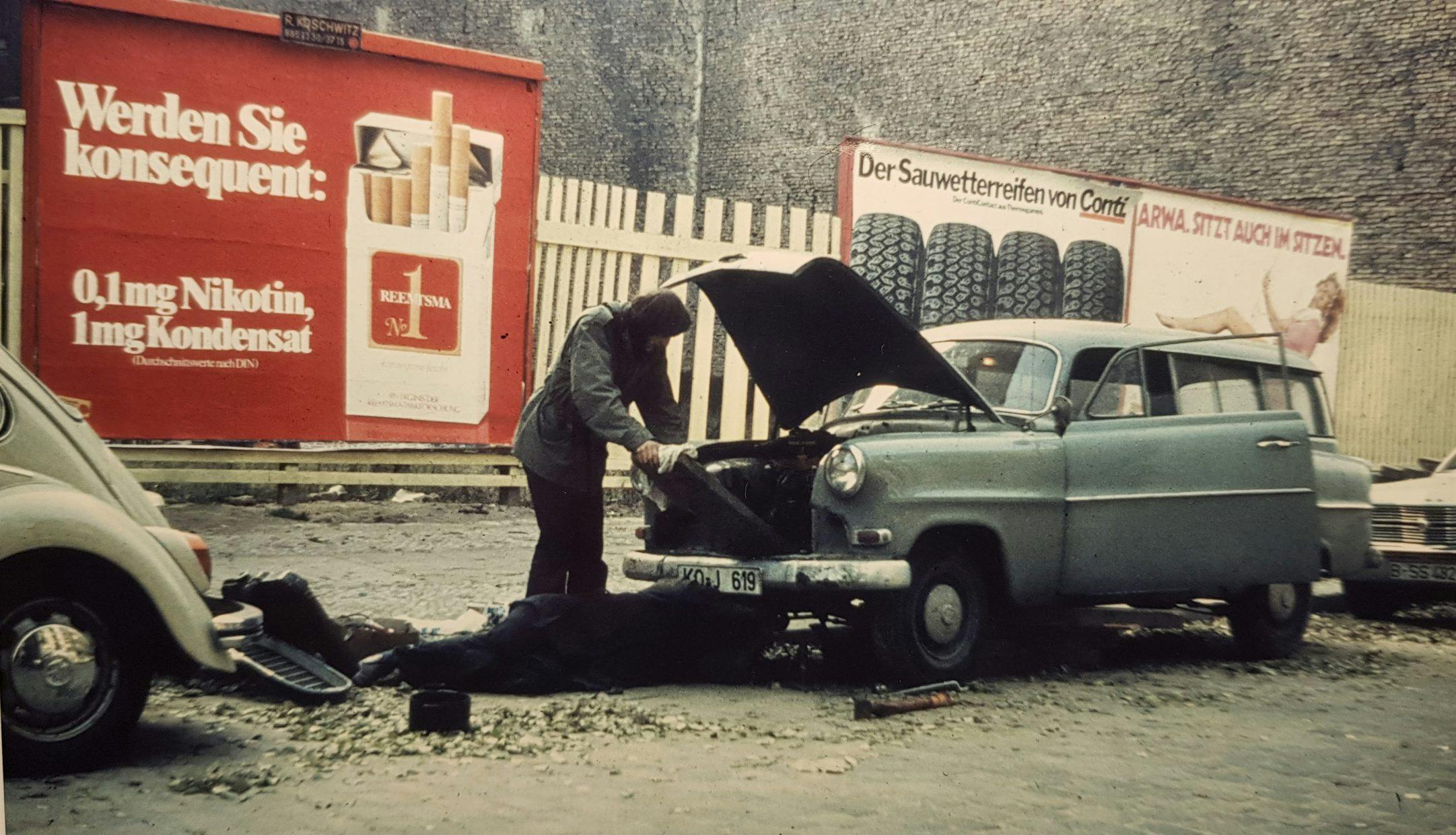 Unwashed Opel roadside fix owner under hood