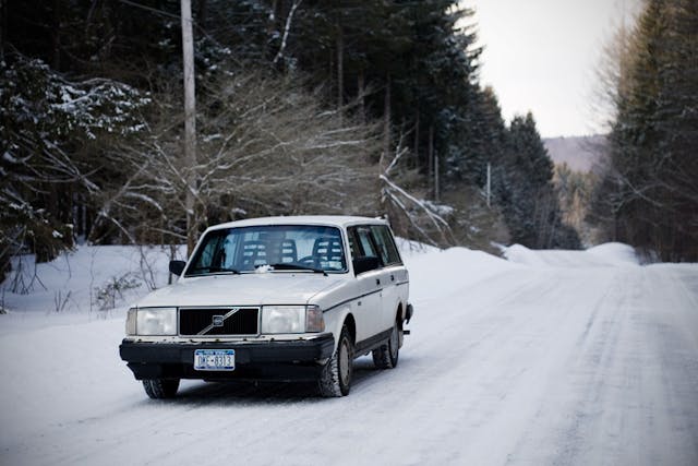 Volvo 240 in the snow front three quarter