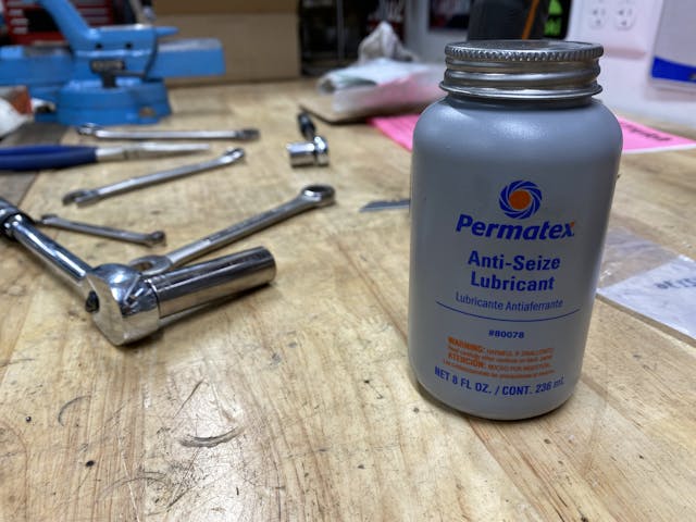 Anti sieze and tools on workbench
