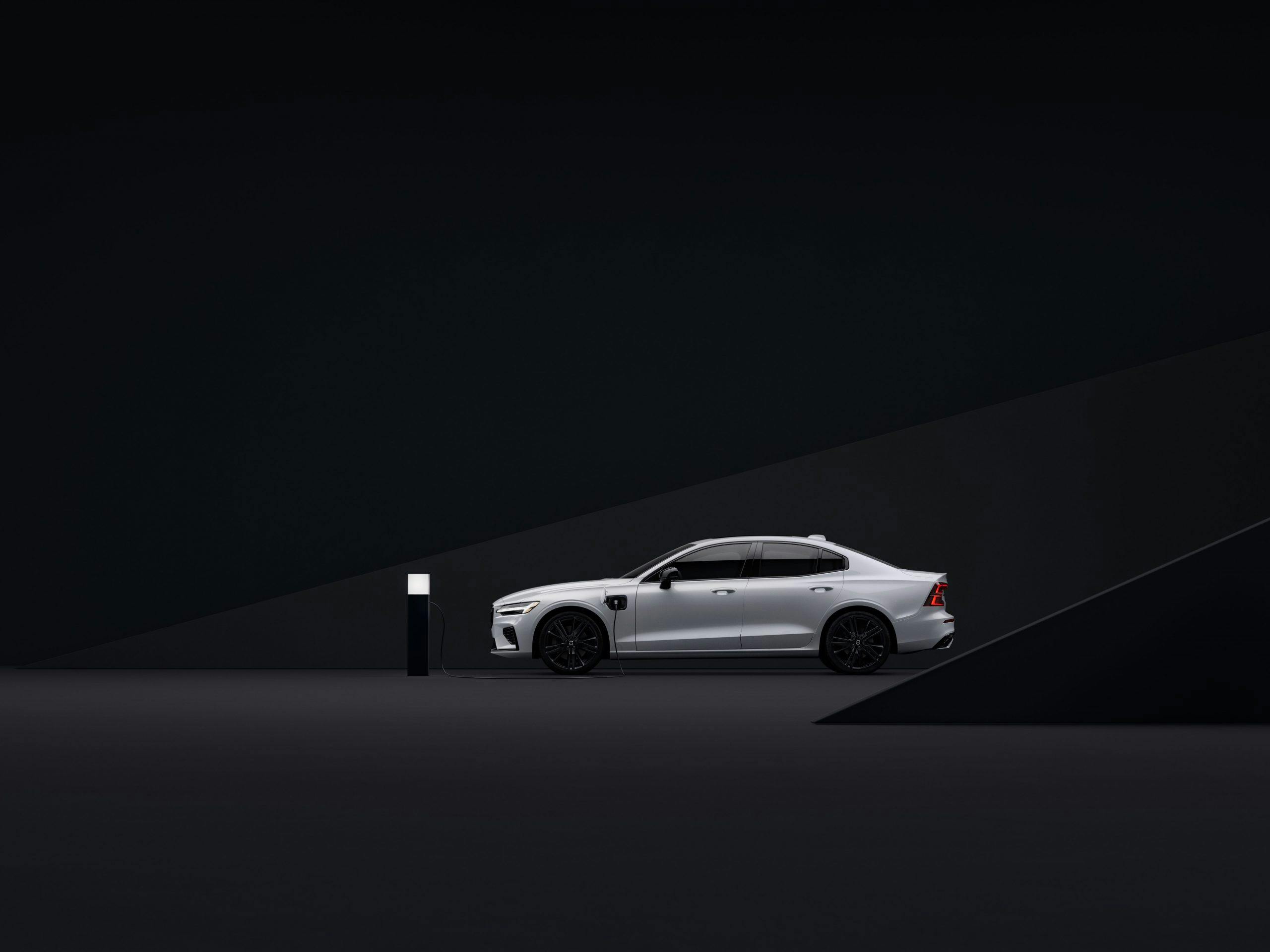 Volvo S60 Black Edition White plugged in side profile studio