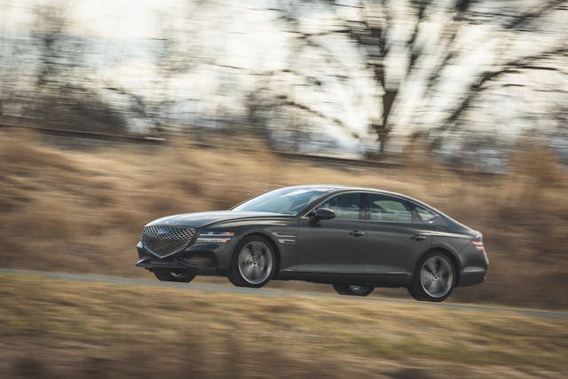 Genesis G80 AWD 3.5T Sport Prestige front three-quarter dynamic action