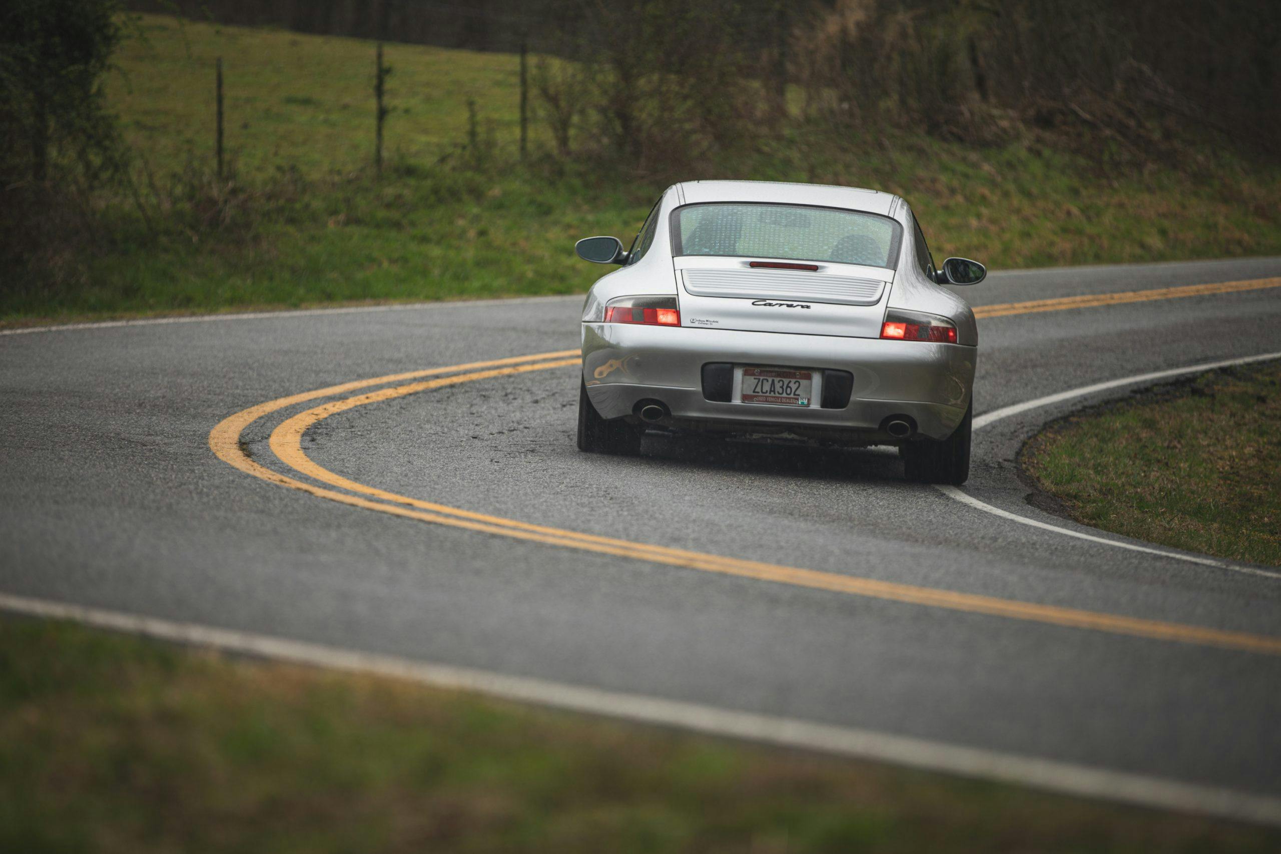 Raby's Porsche rear driving cornering action