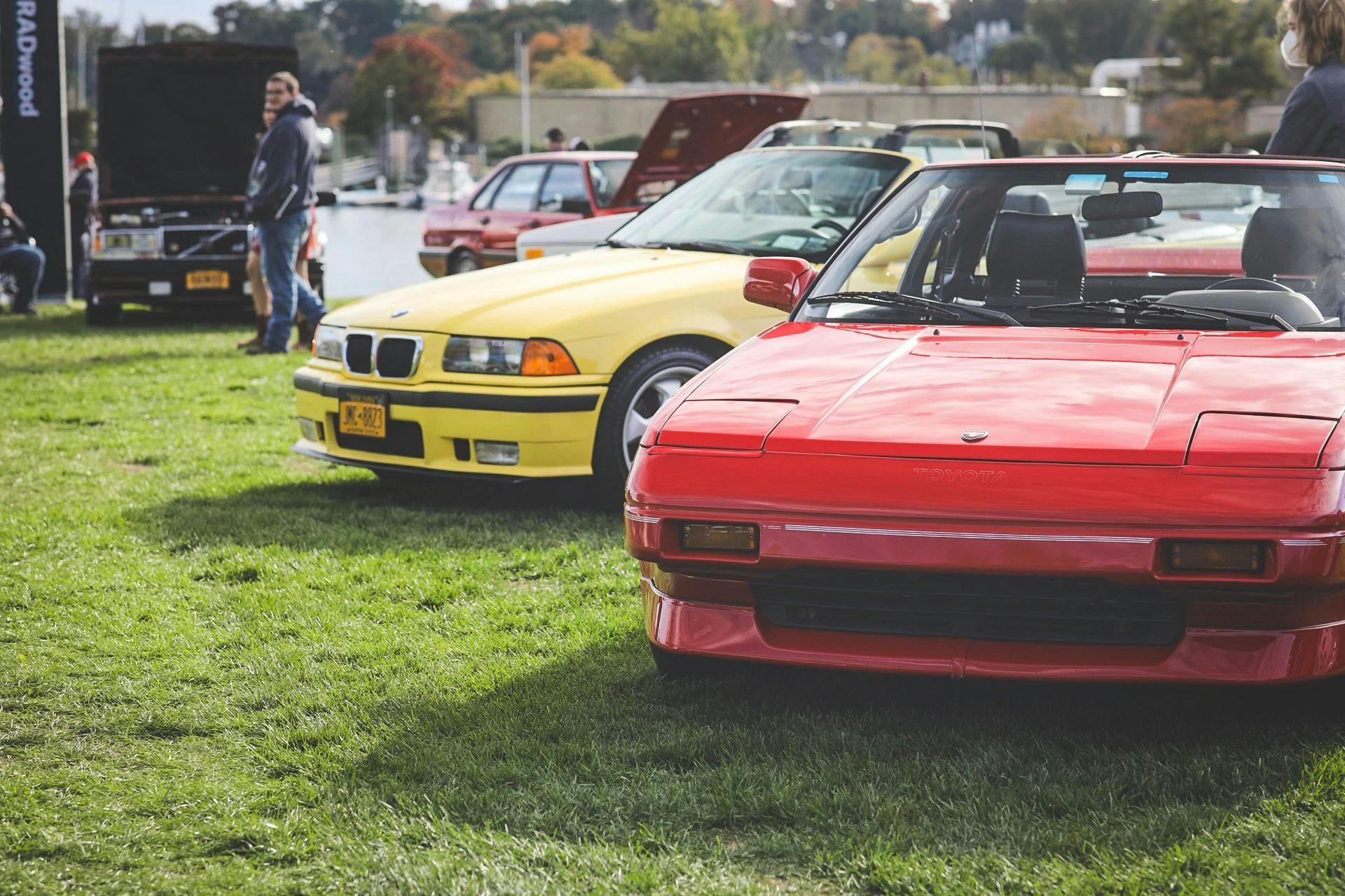 Cars from the 80s and 90s line show field at RADwood event