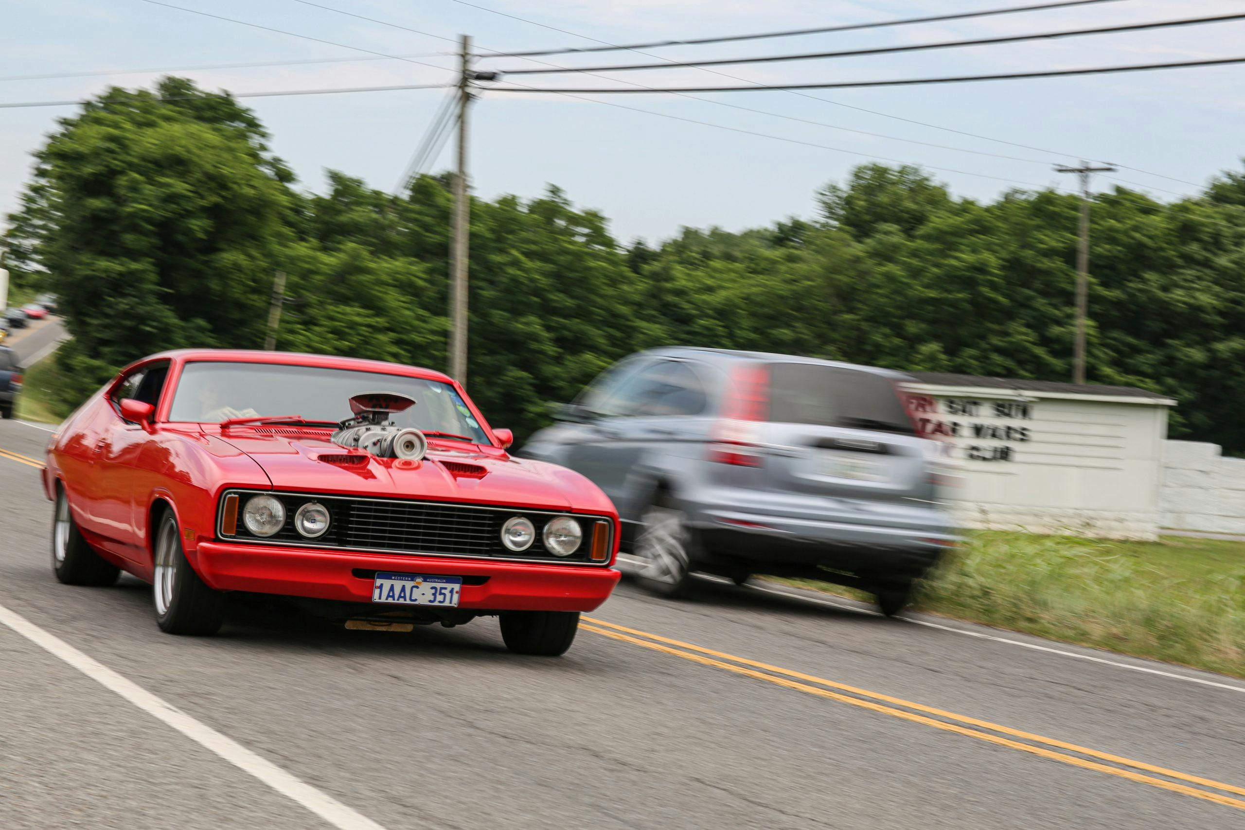 Hot rod cruises the roads during Power Tour