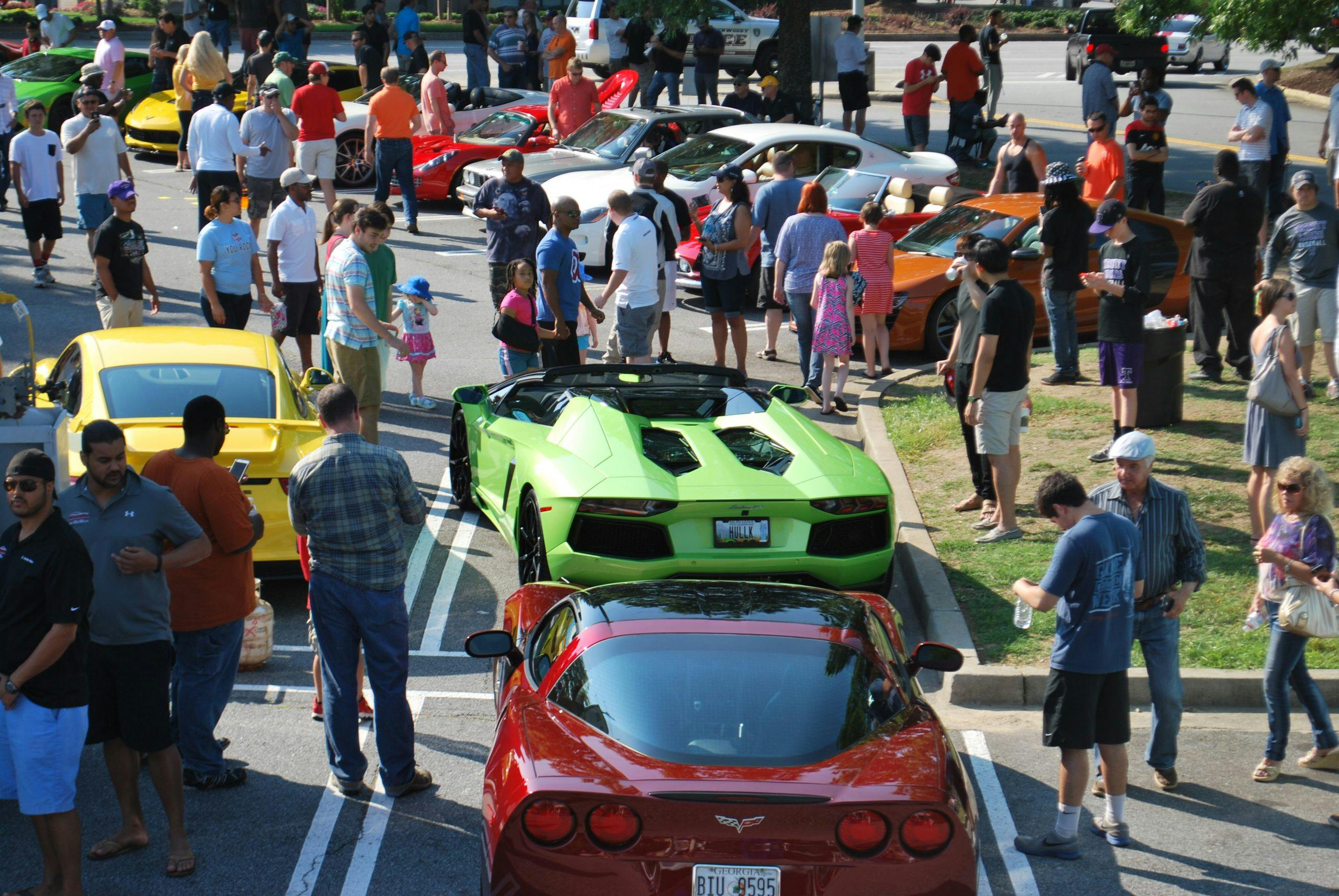 Families gather around a supercar at Caffeine and Octane