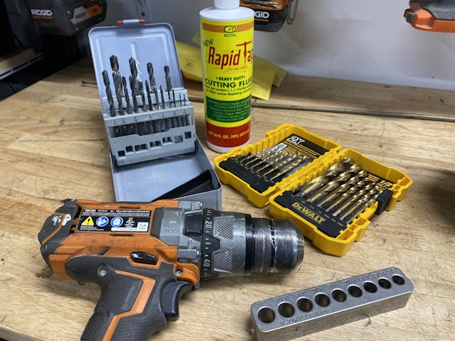 Drill, drill bits, drill block, and cutting fluid