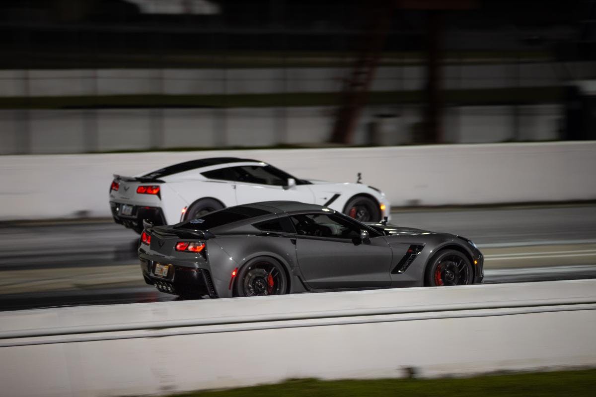 Two Corvettes compete in a roll race
