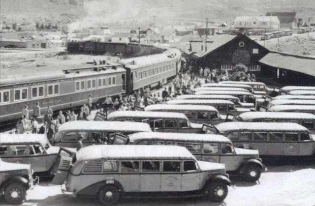 Yellowstone buses meet passengers at the train