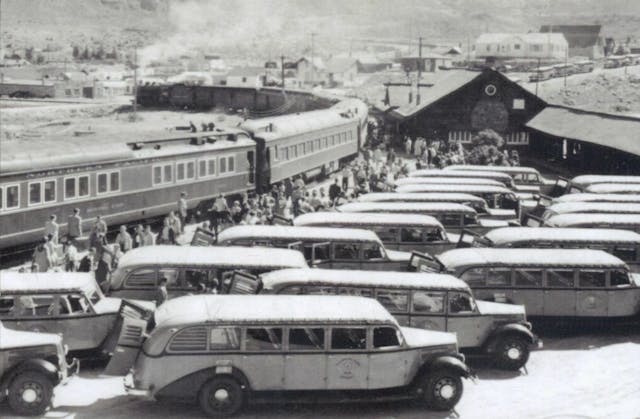 Yellowstone buses meet passengers at the train