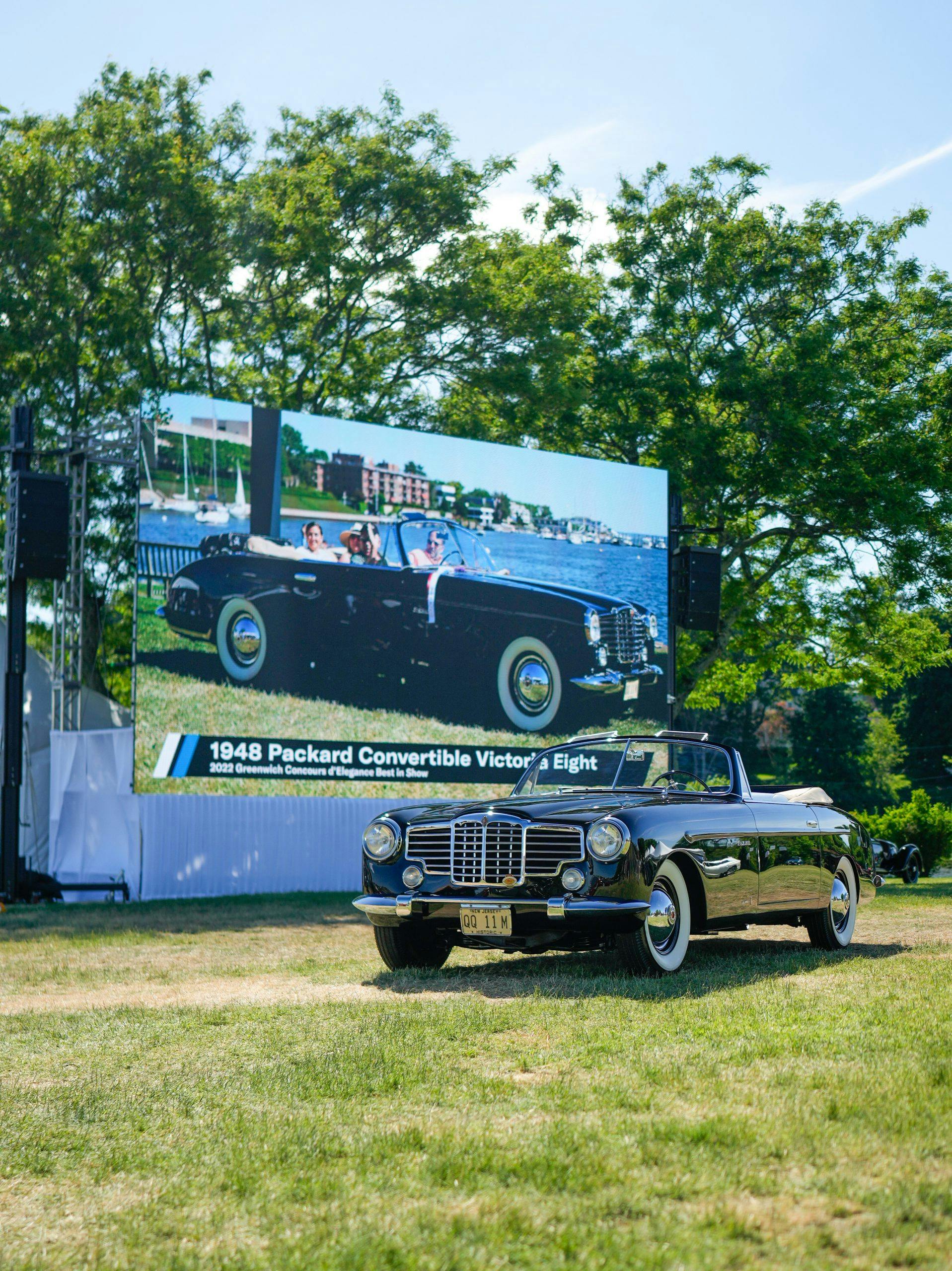 1948 Packard Victoria Convertible Eight by Vignale - 2022 Greenwich Best of Show - in front of Jumbotron