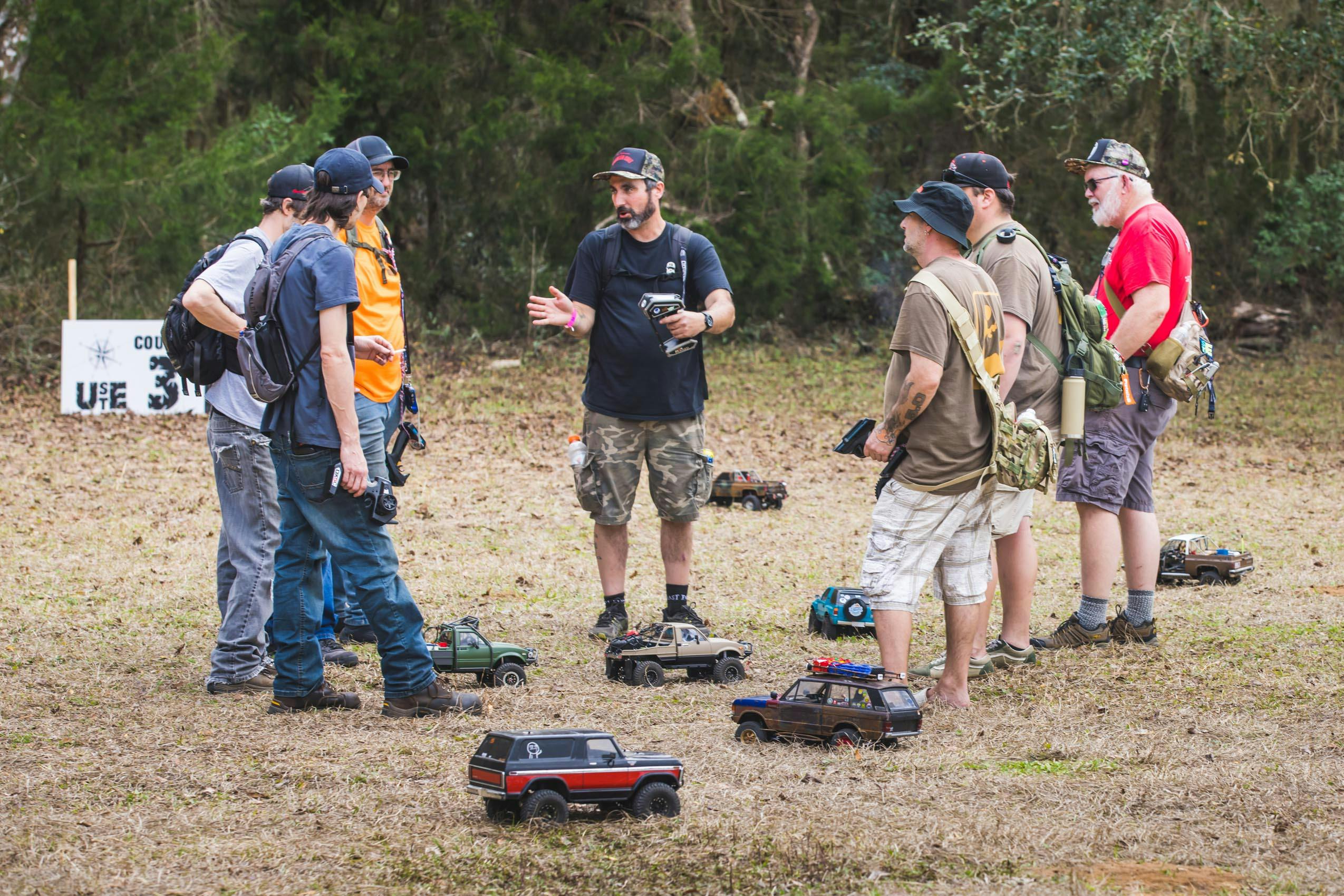 Scale RC Crawlers Group of people and RCs in field