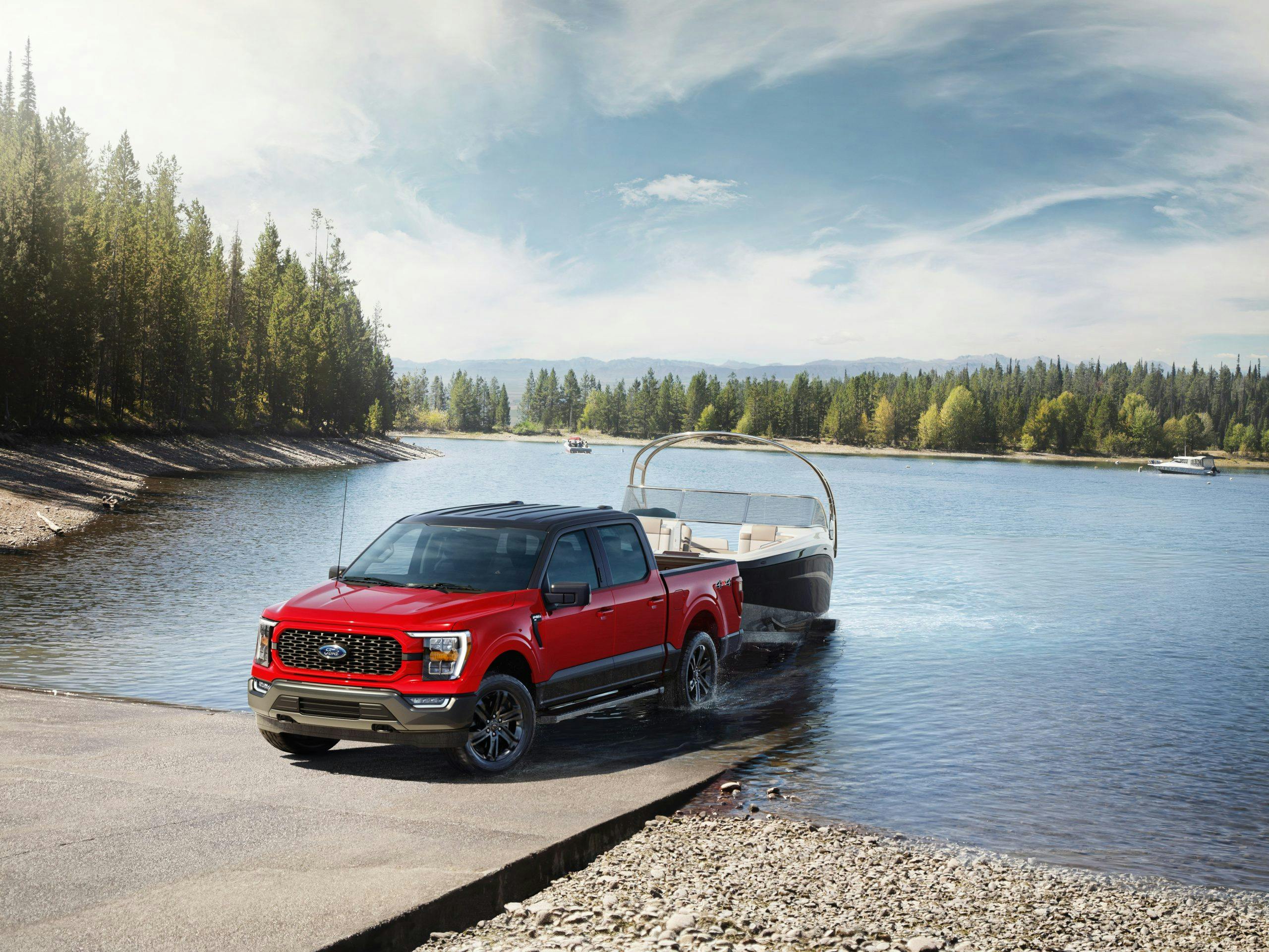 2023 F-150 Heritage Edition exterior red towing boat