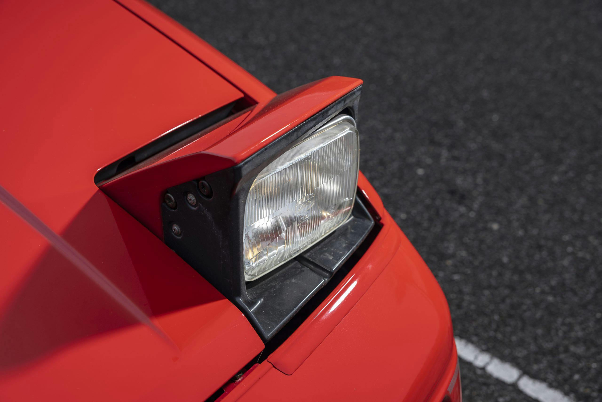 Toyota MR2 pop headlight closeup