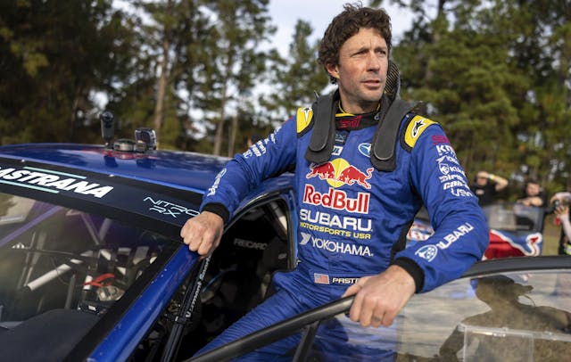 Travis Pastrana standing outside of car