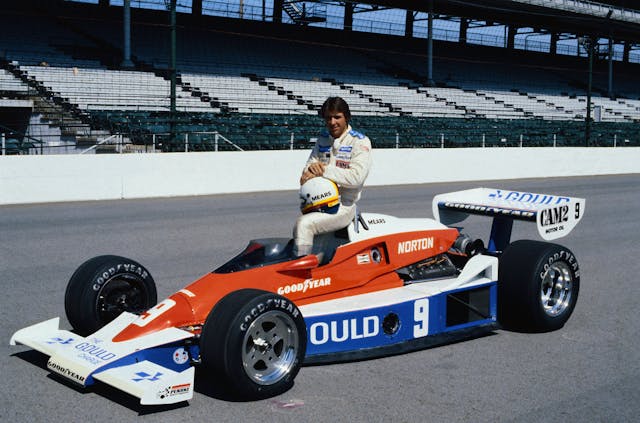 Rick Mears Sitting on Race Car Indy