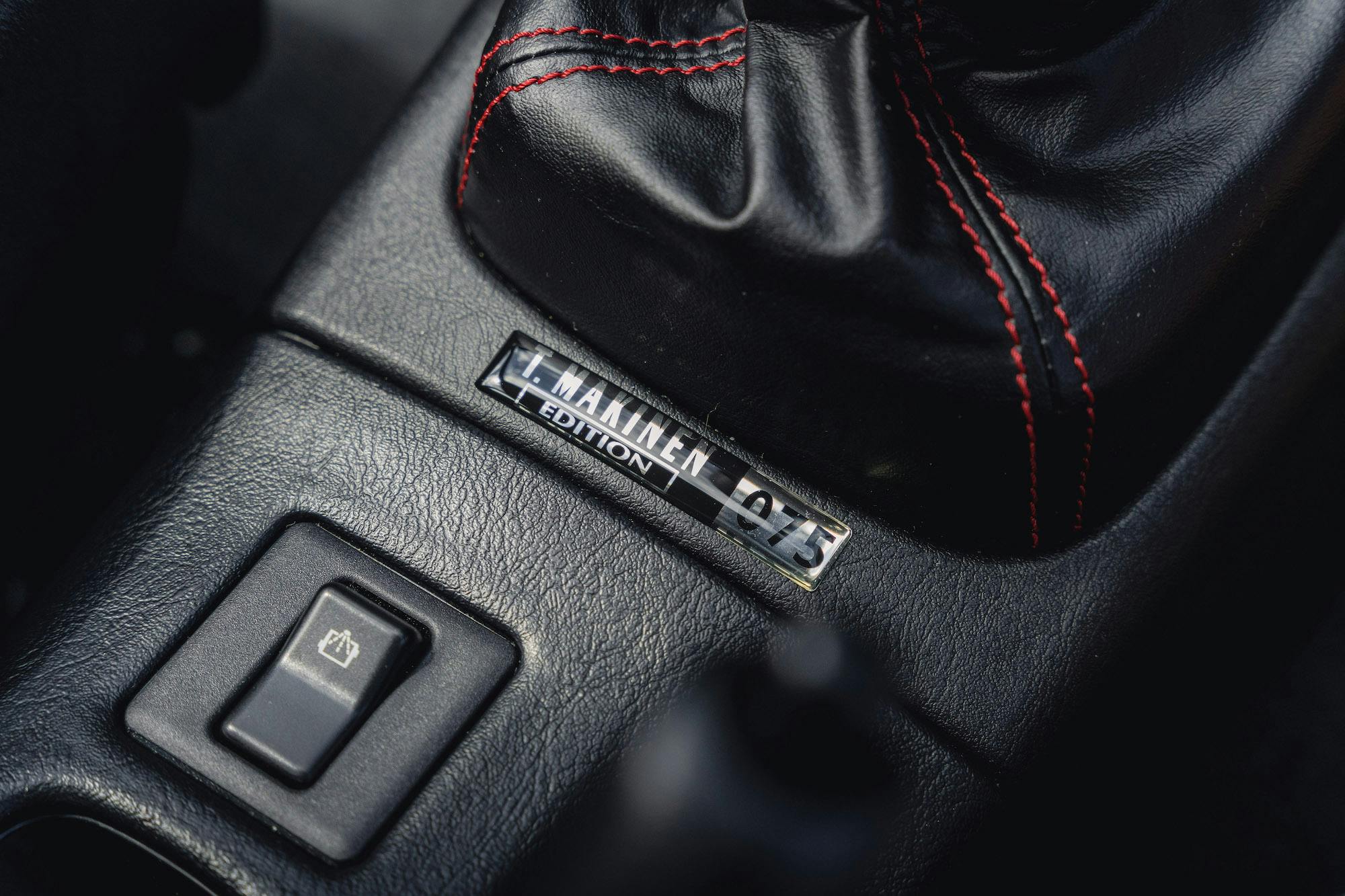 2001 Mitsubishi EVO VI Tommi Makinen interior console badge number 075