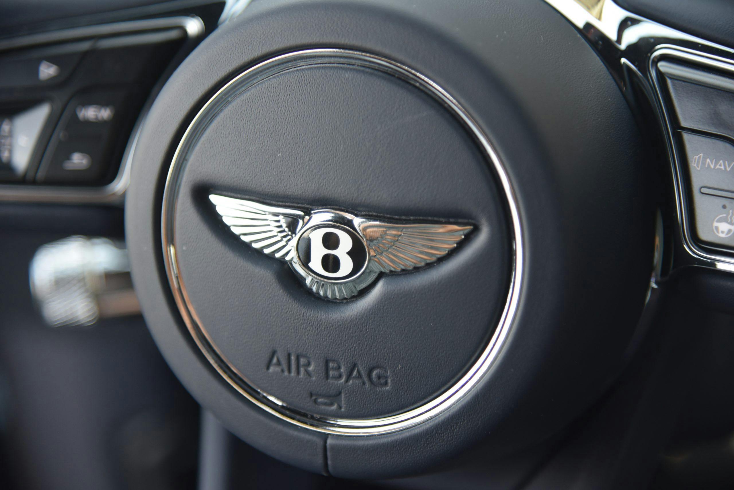 2022 Bentley Flying Spur Hybrid interior steering wheel logo closeup
