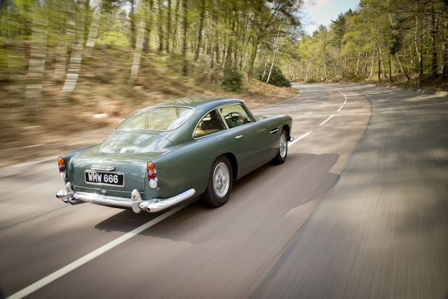 Aston Martin DB4 rear three-quarter driving action