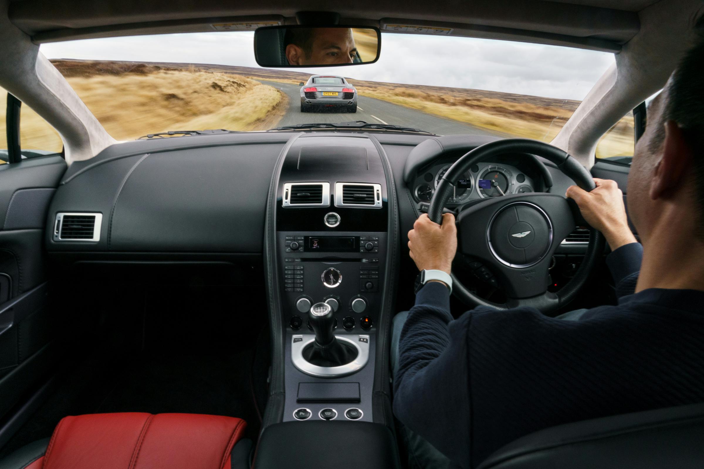 Aston Martin V8 Vantage interior driving action