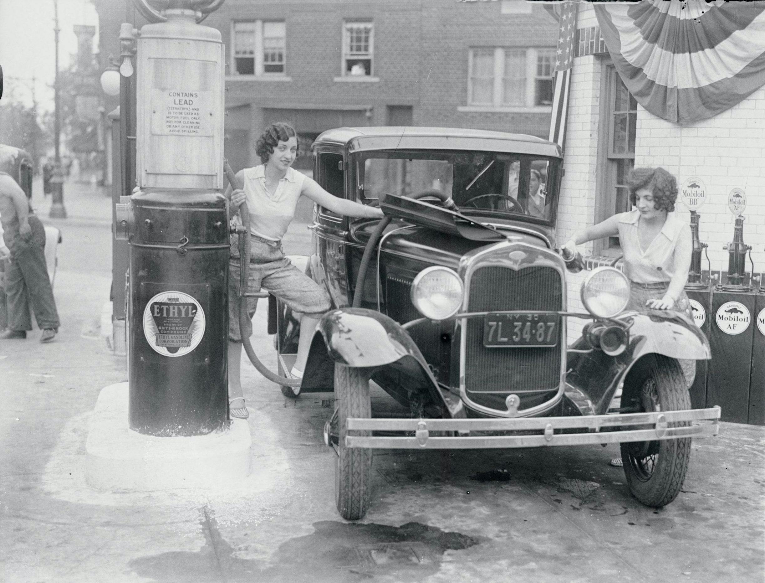 female gas attendants leaded fuel pumps