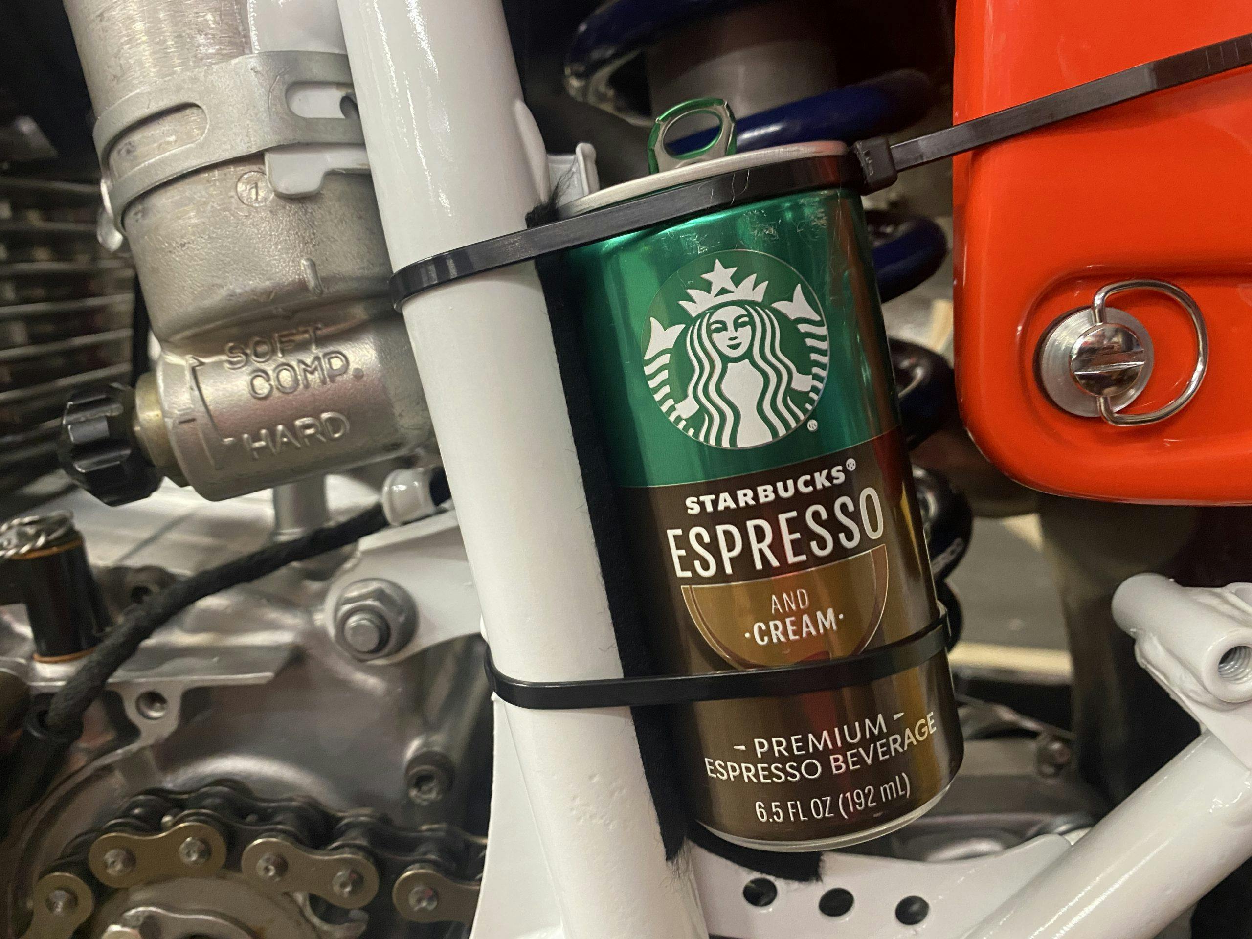 Starbucks DoubleShot Expresso can zip tied to frame