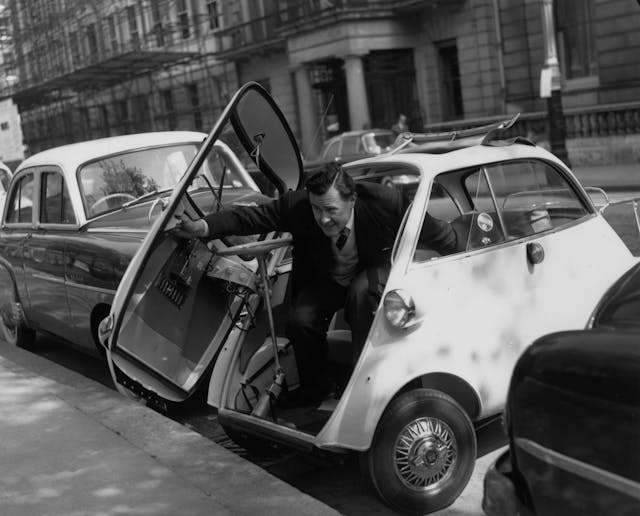 Bubble BMW man exits parked Isetta