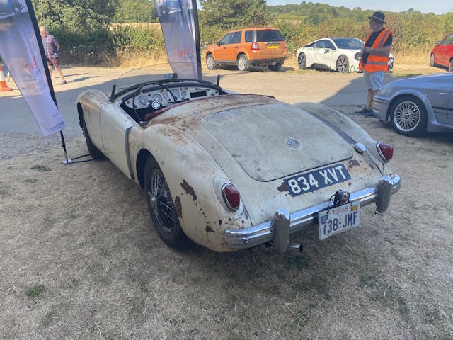 Patina MG roadster rear three-quarter