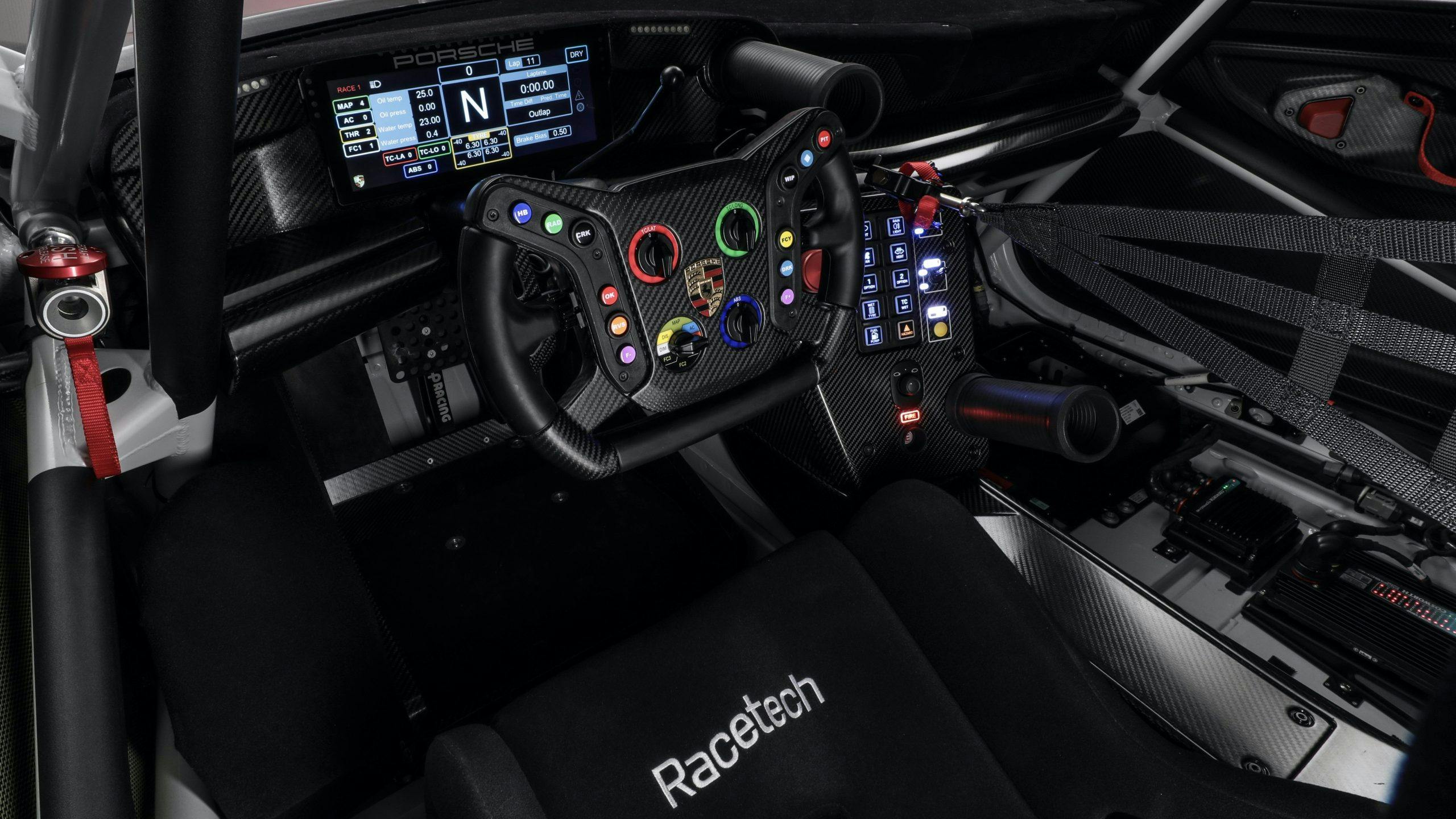 Porsche 992 911 GT3 R race car interior steering wheel and seat