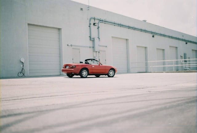 Red MX-5 Miata rear three-quarter wide