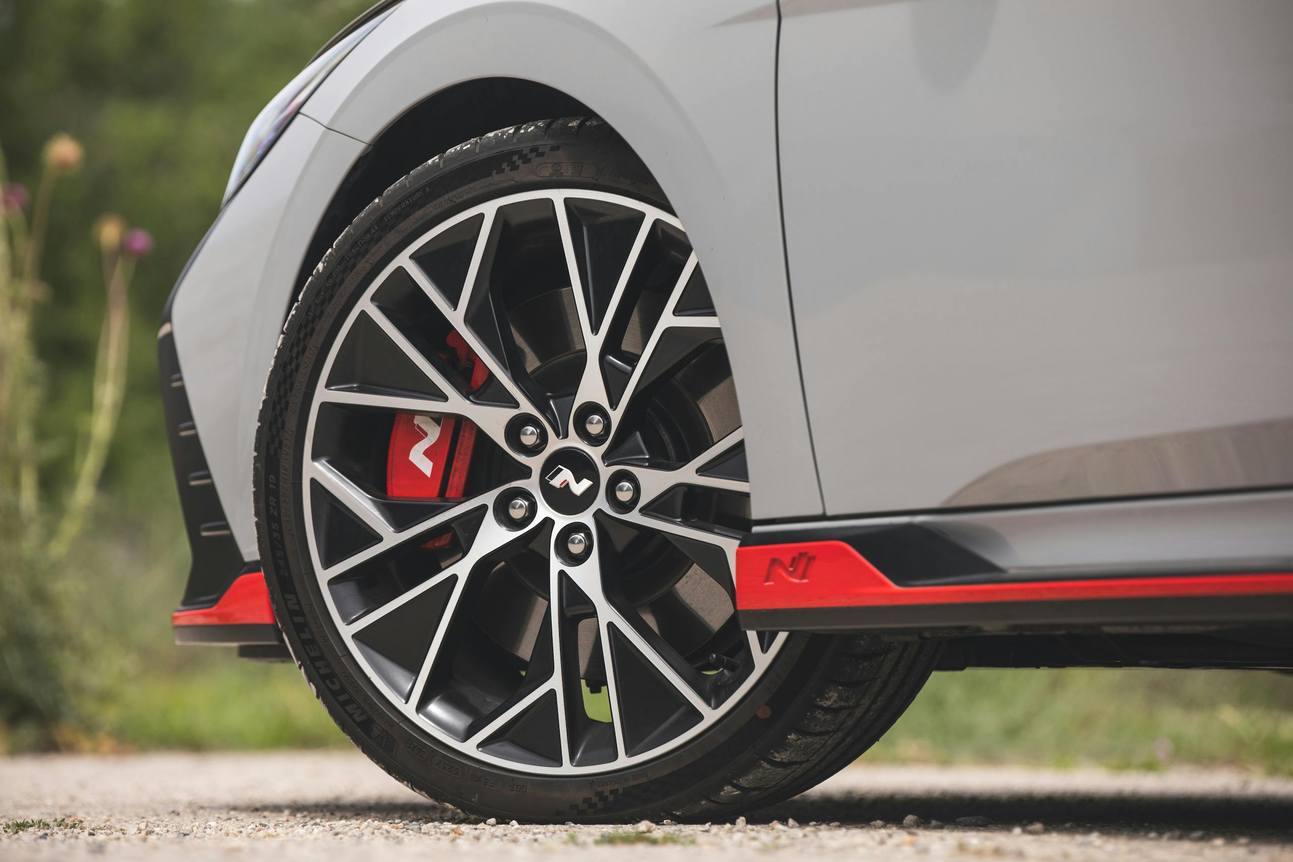 2022 Hyundai Elantra N front wheel tire caliper closeup