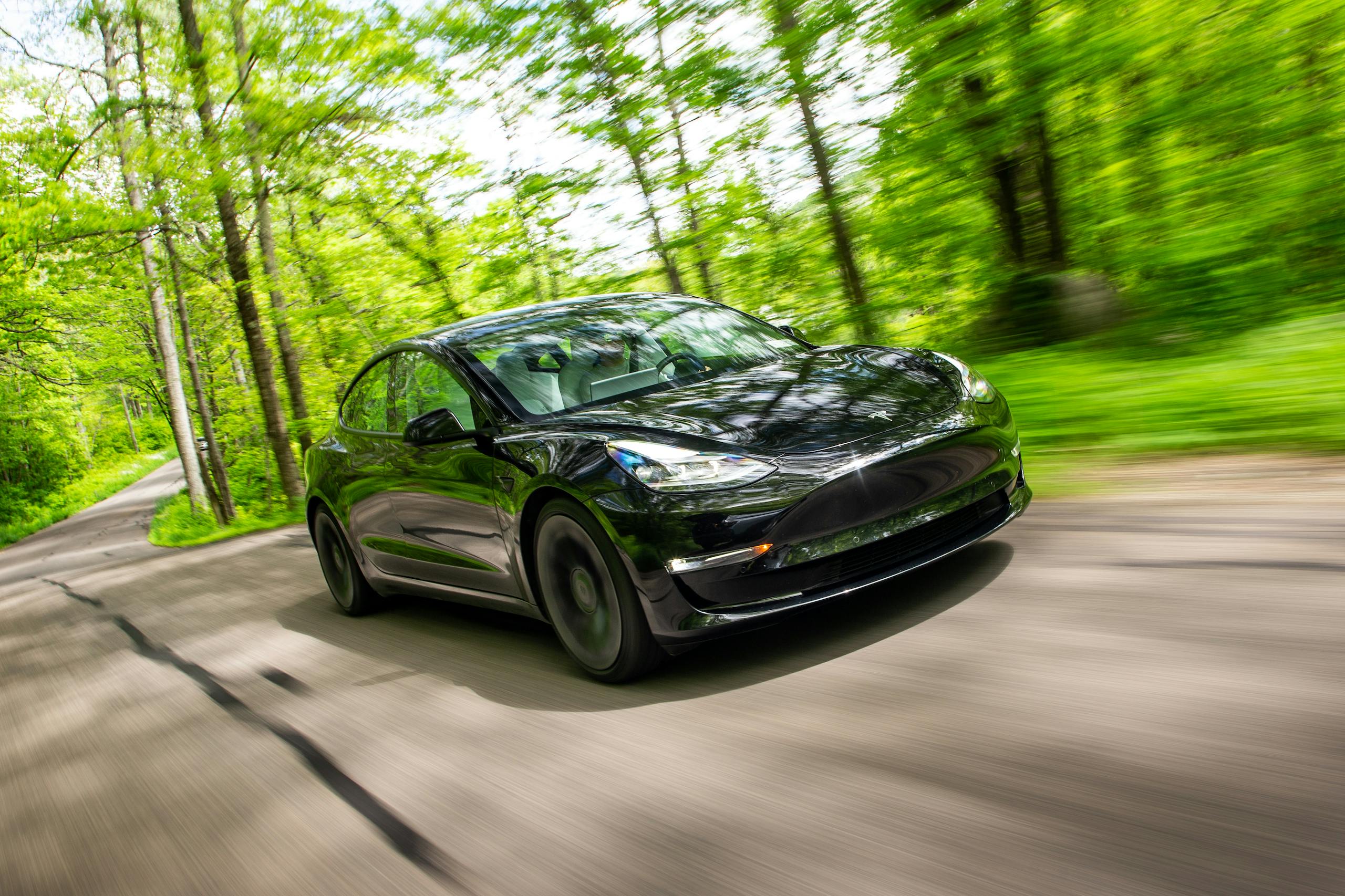 2021 Tesla Model 3 Performance front three-quarter driving action