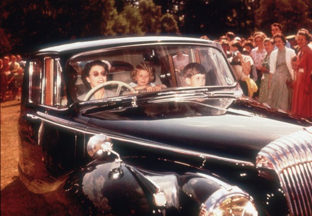 Queen Elizabeth II and Charles and Anne Daimler 1957 driving