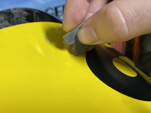 using razorblade to release air bubble in decal