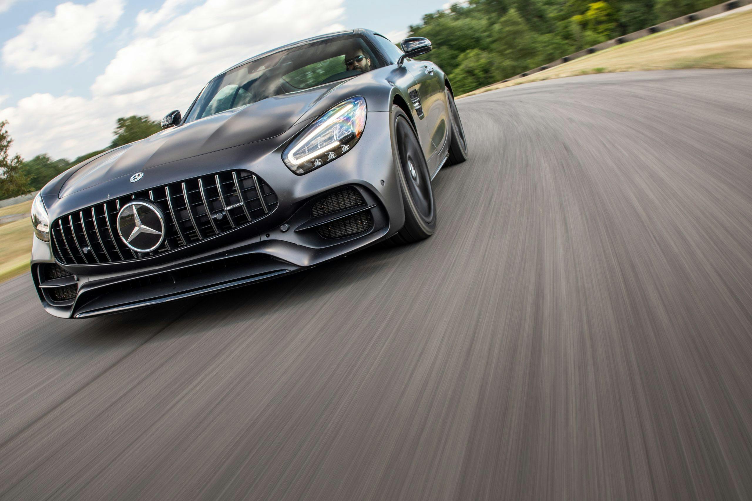 2021 Mercedes-AMG GT Stealth Edition front three-quarter low angle dynamic motion