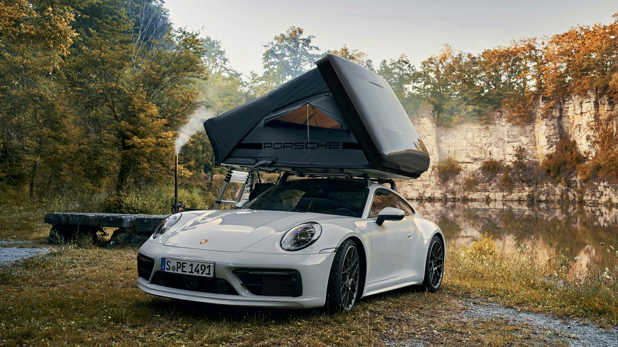 Porsche rooftop tent 911 with tent pitched along riverside