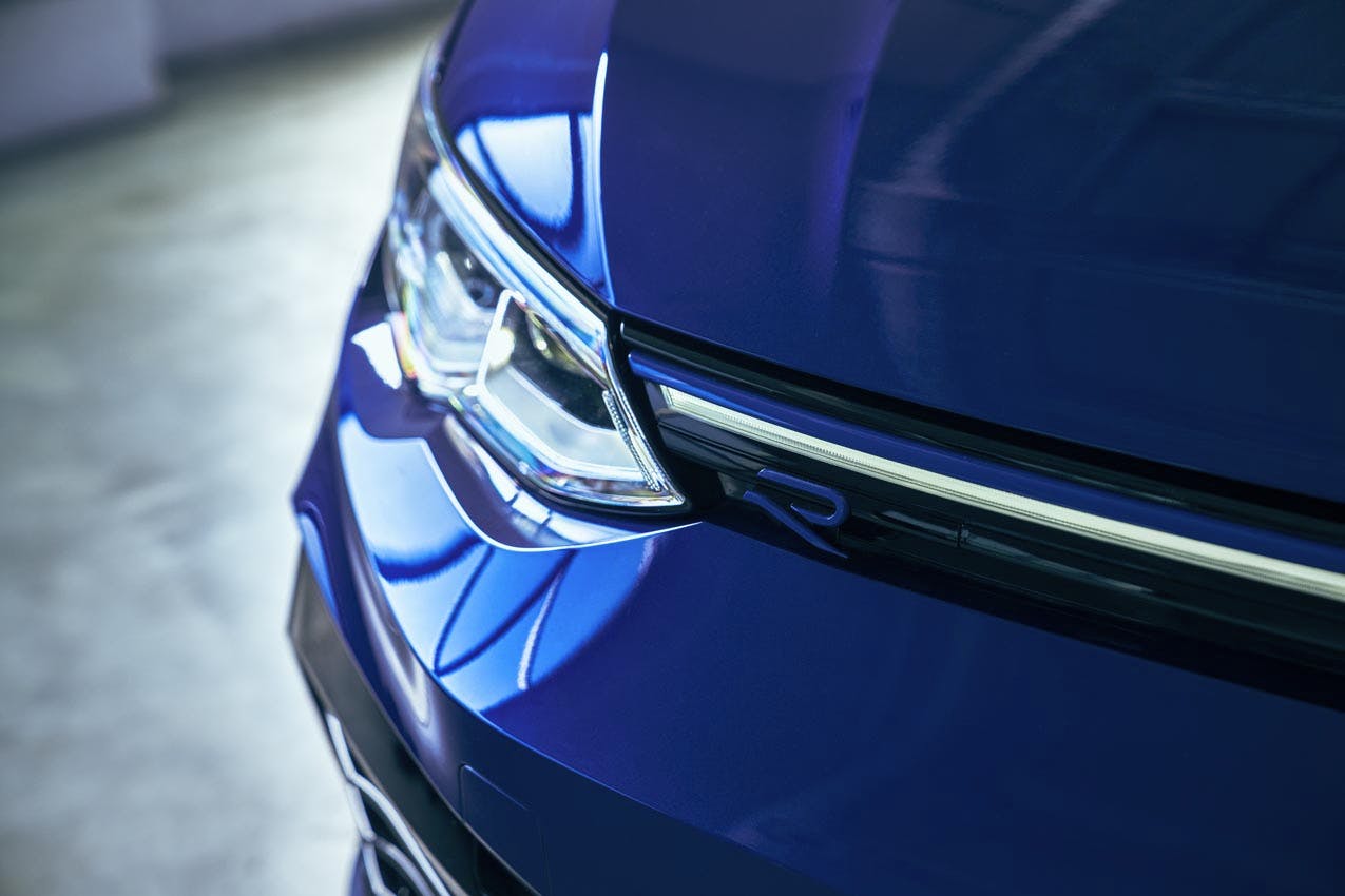 Volkswagen Golf R 20th Anniversary Edition exterior headlight and R badge detail