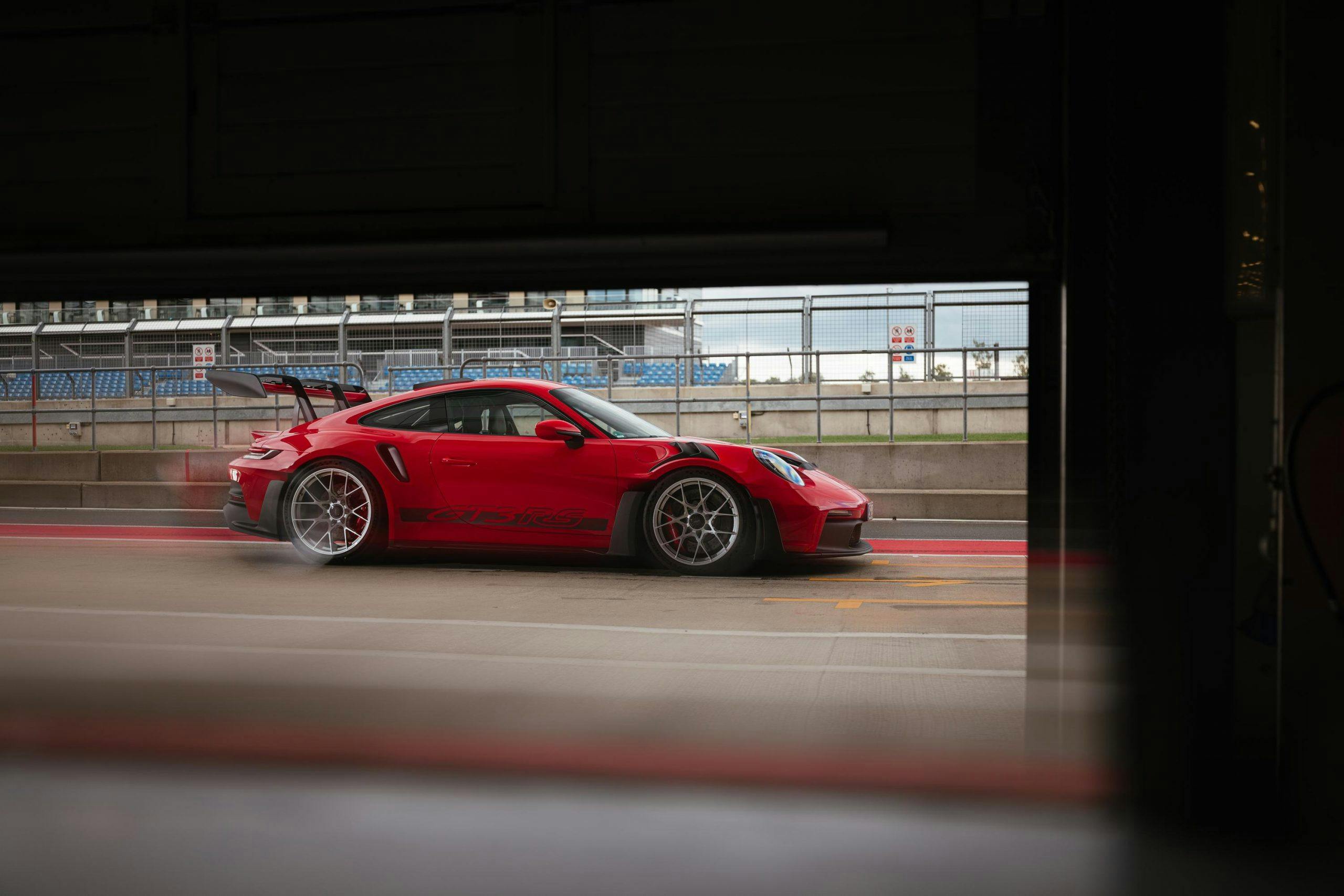 2023 Porsche 911 GT3 RS Guards Red side view action blur
