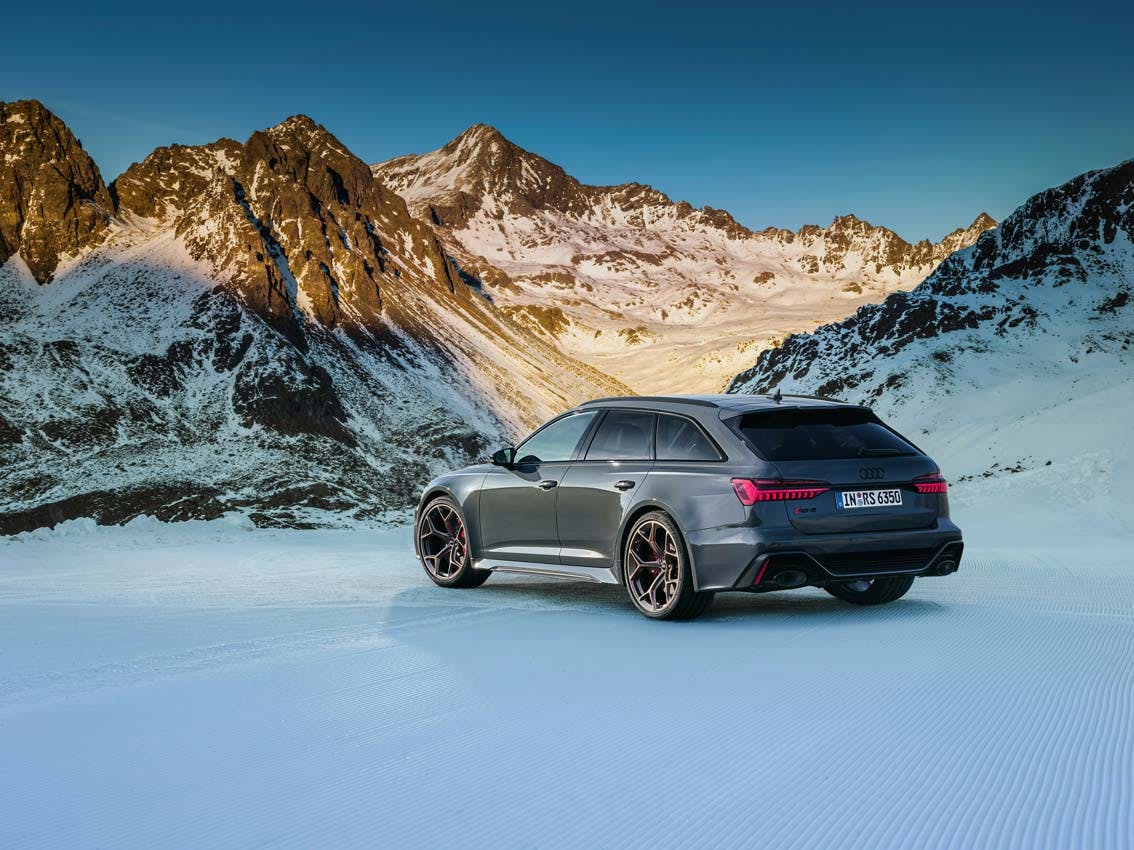 Audi RS 6 Avant performance exterior rear three quarter in mountains