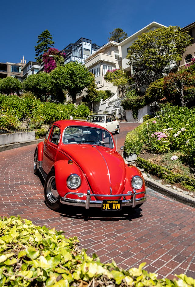 Volkswagen Beetle Austin Mini descend Lombard Street landmark San Francisco California
