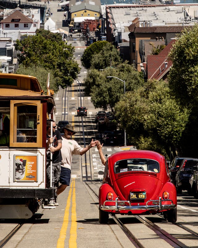 Volkswagen Beetle San Francisco city trolley high five