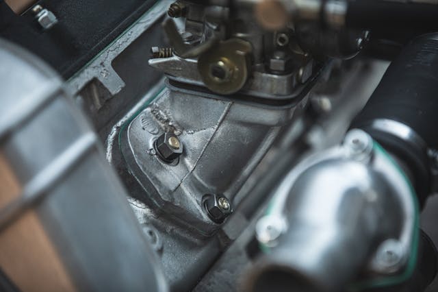Ferrari Dino quad cam engine carb flange