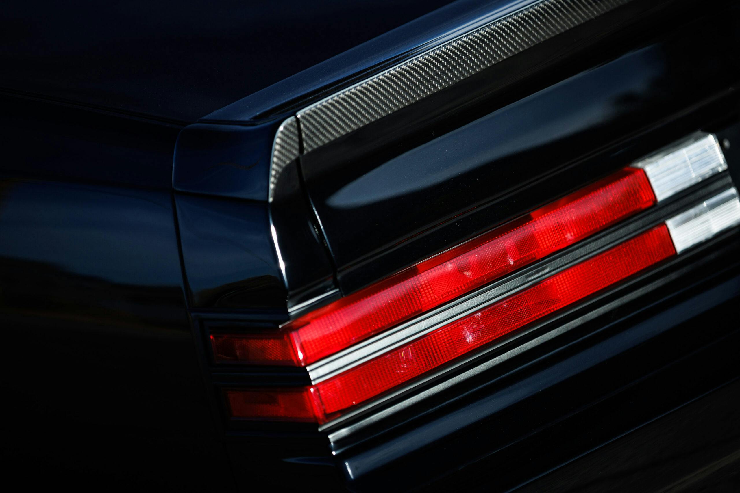 Kevin Hart Buick Grand National restomod taillight carbon fiber lip closeup