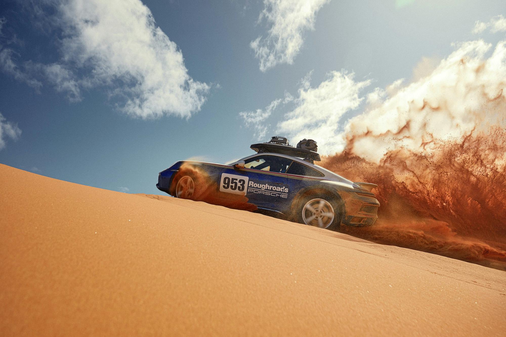 Porsche 911 Dakar side dune driving action