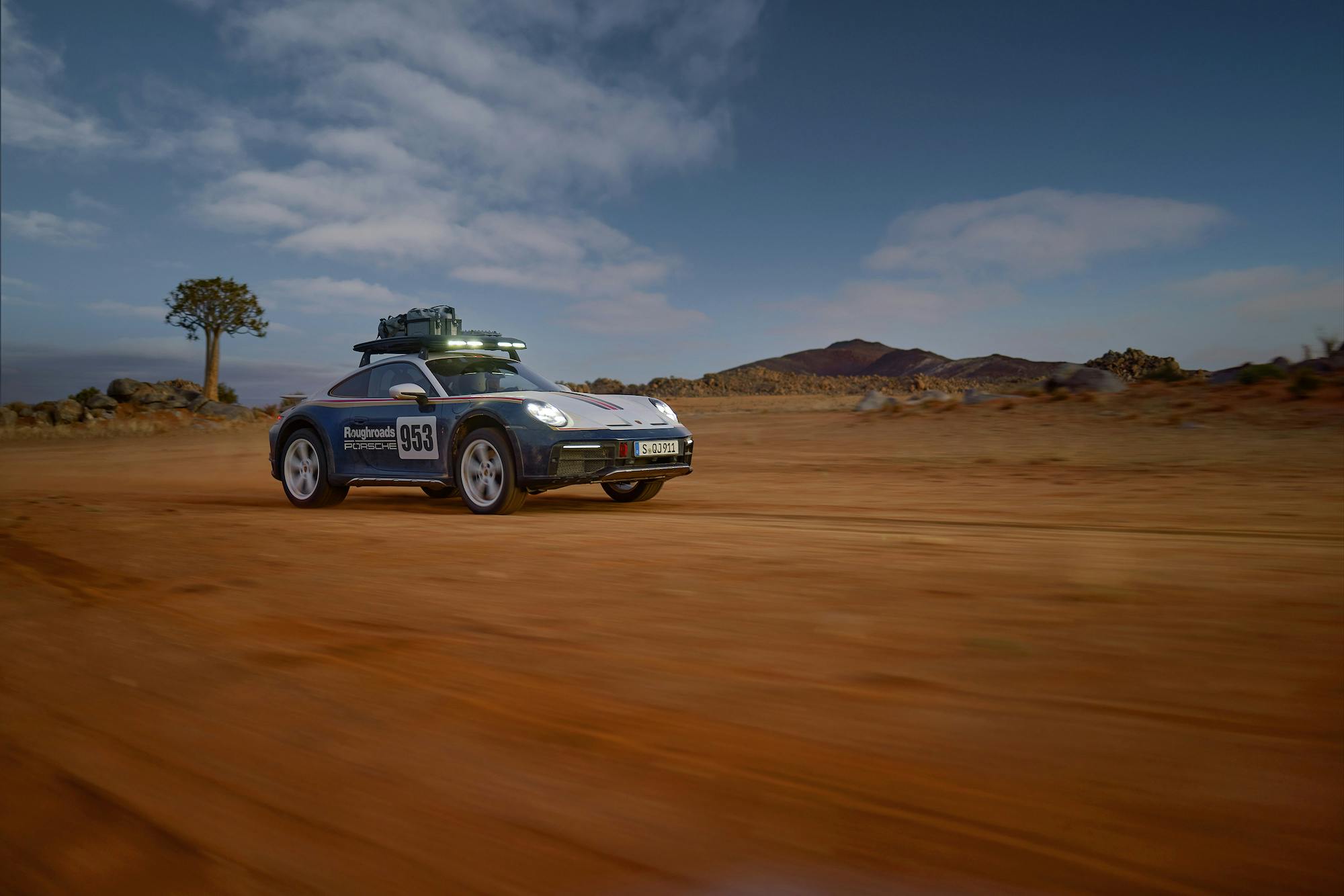 Porsche 911 Dakar front three-quarter off-road action