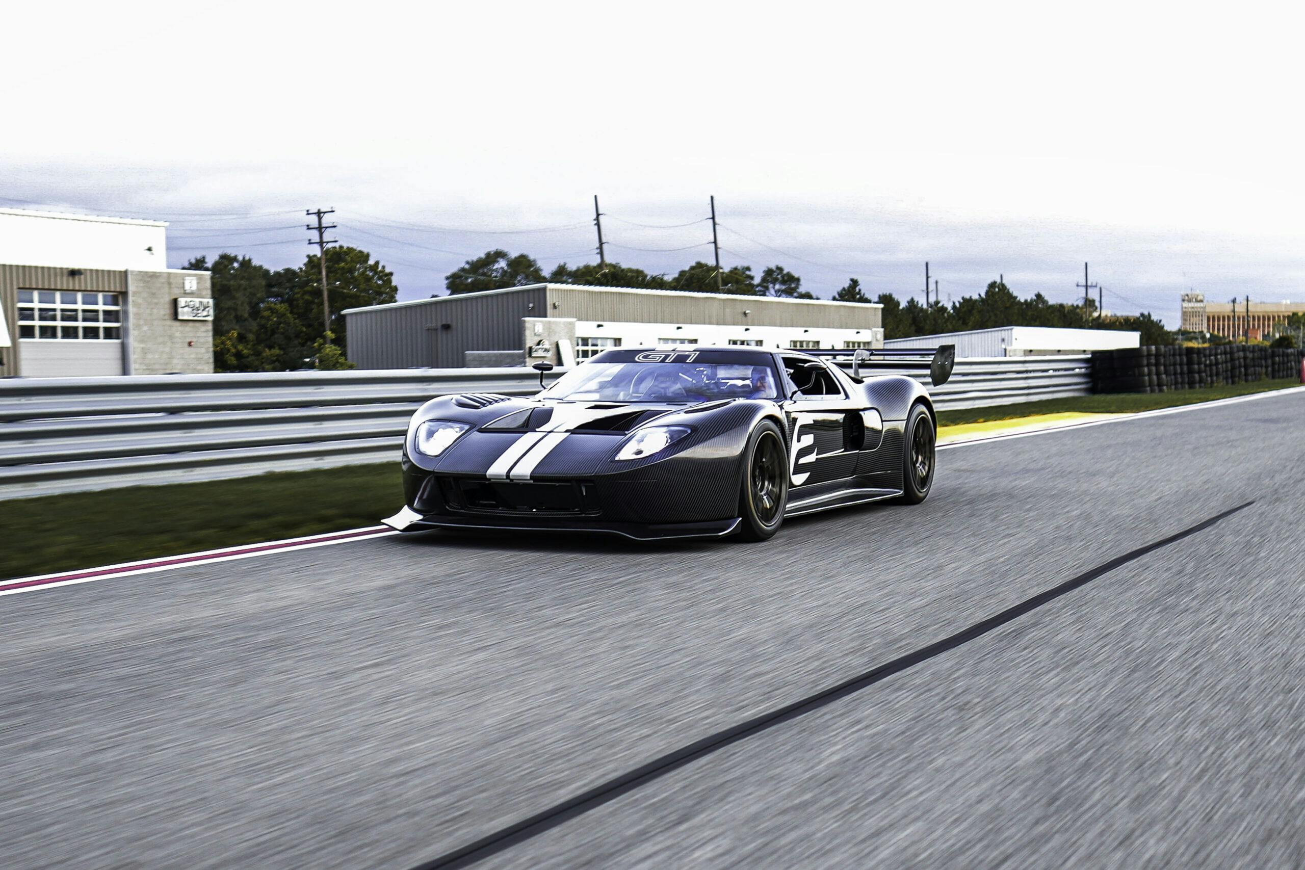 GT1 Ford GT exterior front three quarter driving on track low