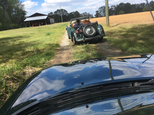 MG TD rear driving down two track