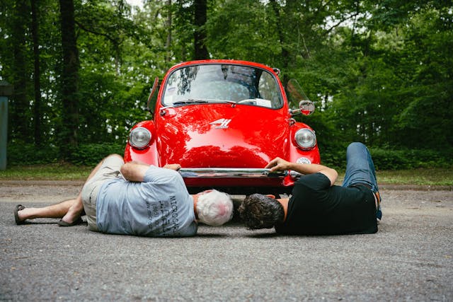 Red microcar underside inspection front