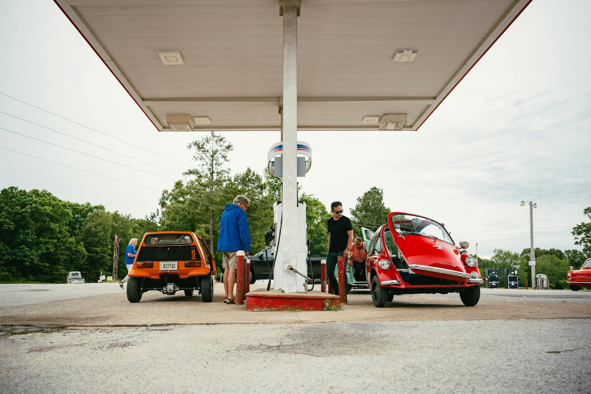 Microcars fueling up at gas station