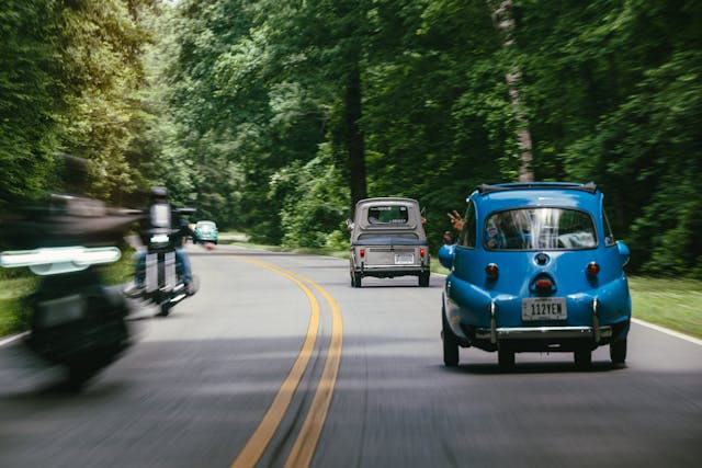 Microcars passing motorcyclists